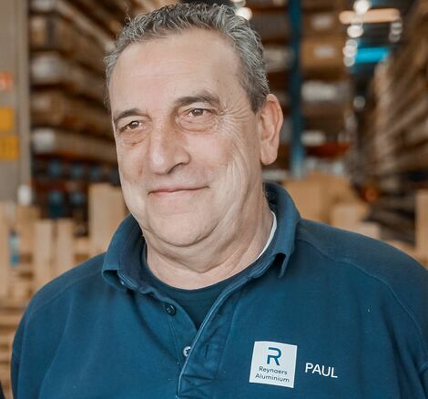 Portrait photograph of Paul De Caerle, Senior Warehouse Order Picker at Reynaers Aluminium.
